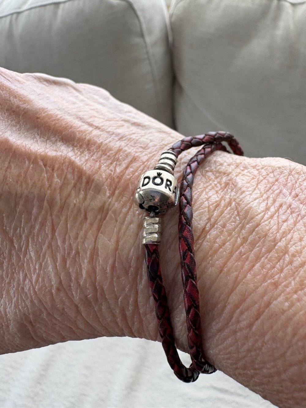 Pandora sterling silver and double braided leather bracelet